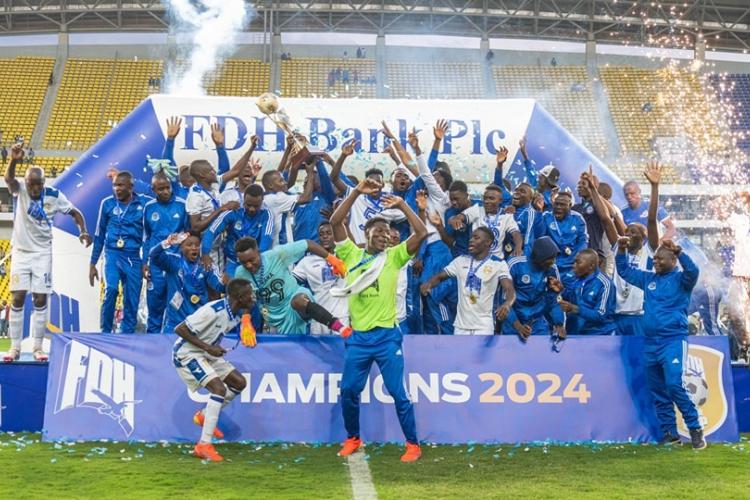 Blue Eagles Players lifting the trophy